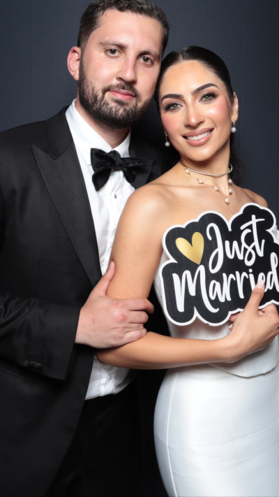 Elegant wedding couple at luxury photo booth