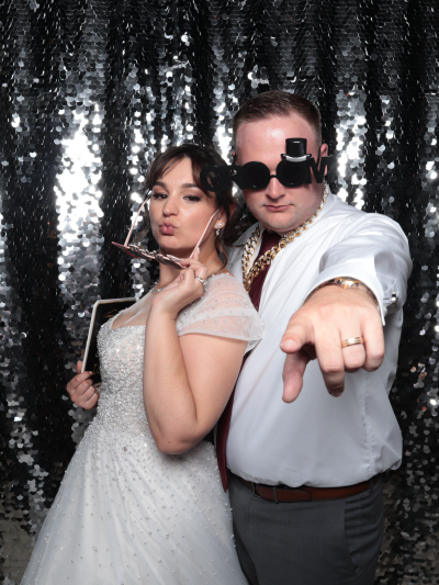 Bridal party posing at elegant photo booth